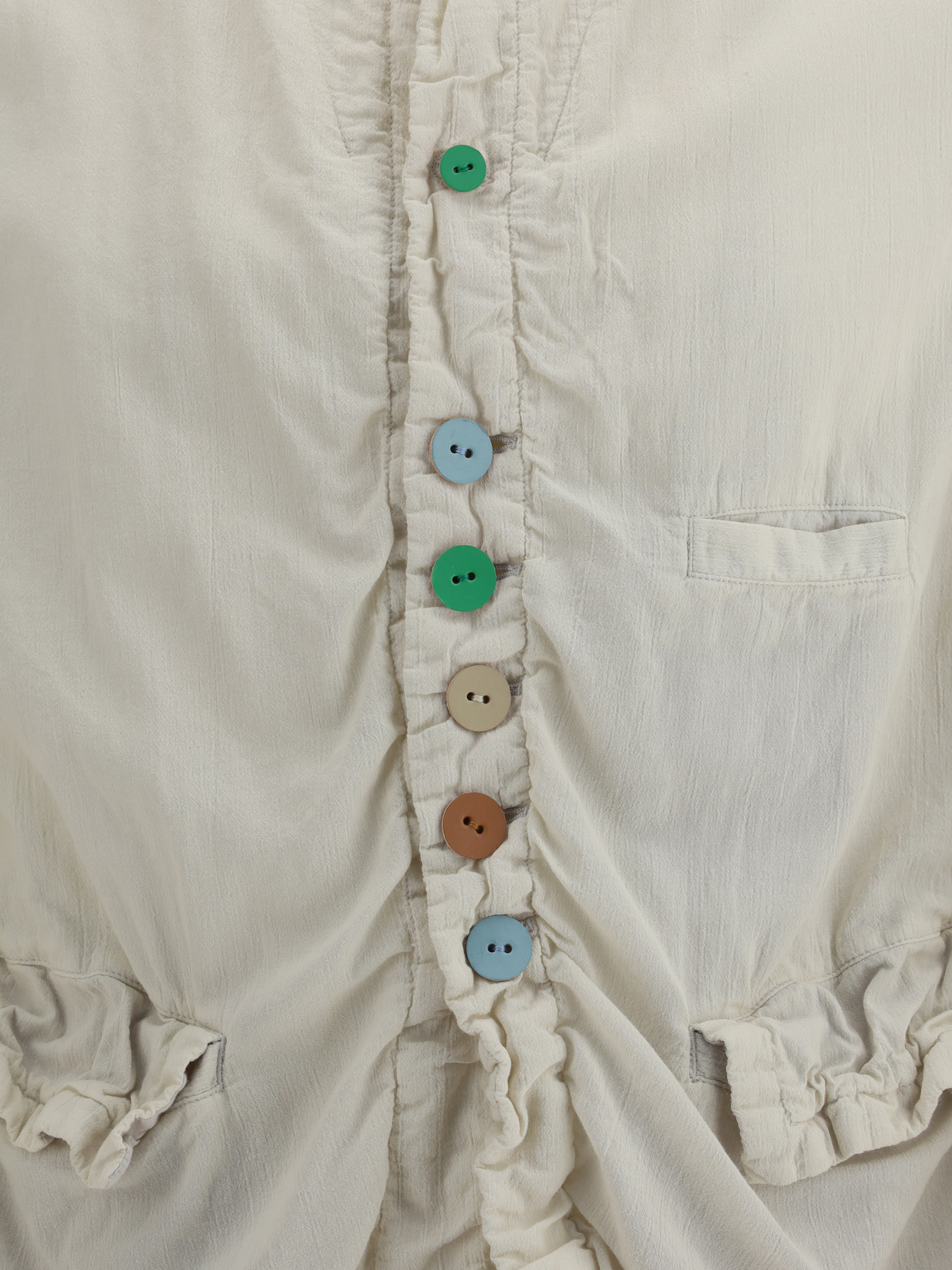 Jacket with multicolored button